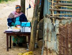woman cooks french fries by the roadside in Addis Ababa, Ethiopia
